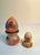 SKU: OT 3388 Vintage Carved Soapstone Egg & Rainbow Stone Egg Set of 2 w/ Stands The larger soapstone egg and pedestal...