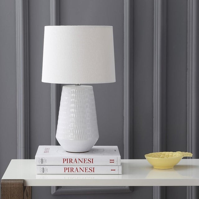 Illuminate your space with the elegant Stark table lamp. Standing at 18 inches, this white ceramic lamp brings...
