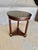 Found in the South of France, this Early 20th Century French Walnut Empire Style Side Table dates back to the early...