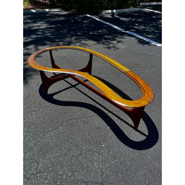Mid-century modern boomerang coffee table, no glass top inset included. Silhouette series by Lane Furniture. An elegant...