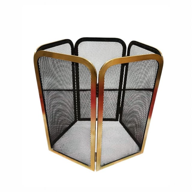 This vintage fireplace screen, crafted from brass with black metal mesh, consists of five hinged panels that allow you to...