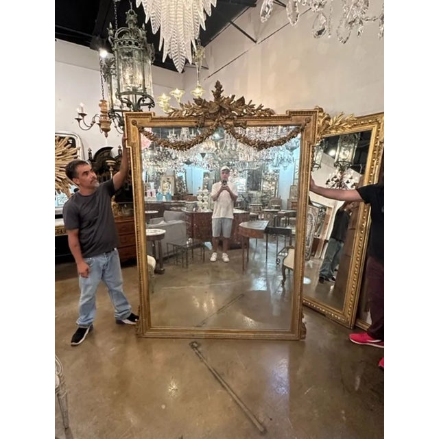Exceptional large scale 19th century Louis XVI carved and giltwood floor mirror. Gorgeous intricate carvings along the top...