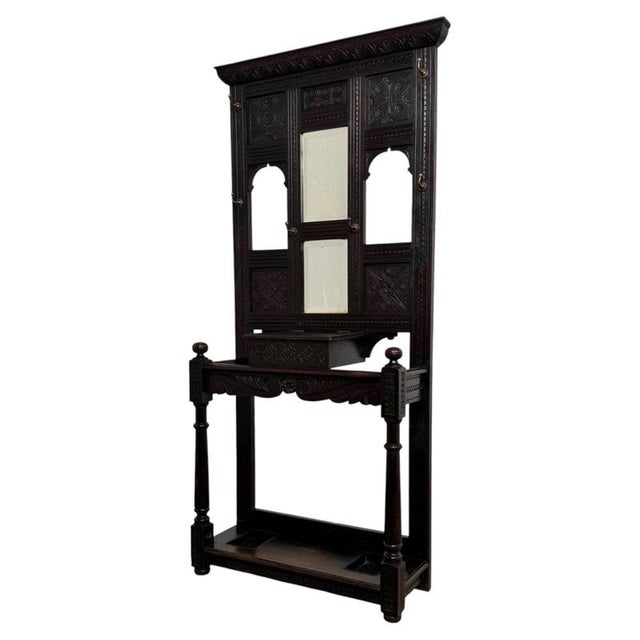 An impressive 19th-century English Victorian hall stand, finely crafted from solid oak and distinguished by its extensive...