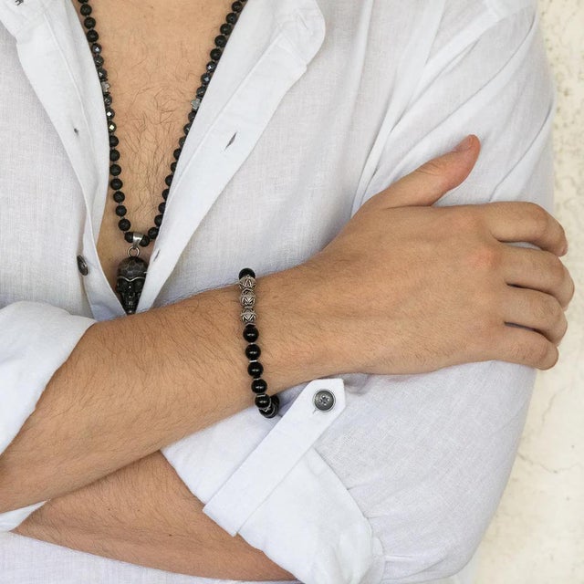 The Silver Beads & Black Onyx Stone Beaded Bracelet is a unique and striking piece of handmade jewelry that combines the...