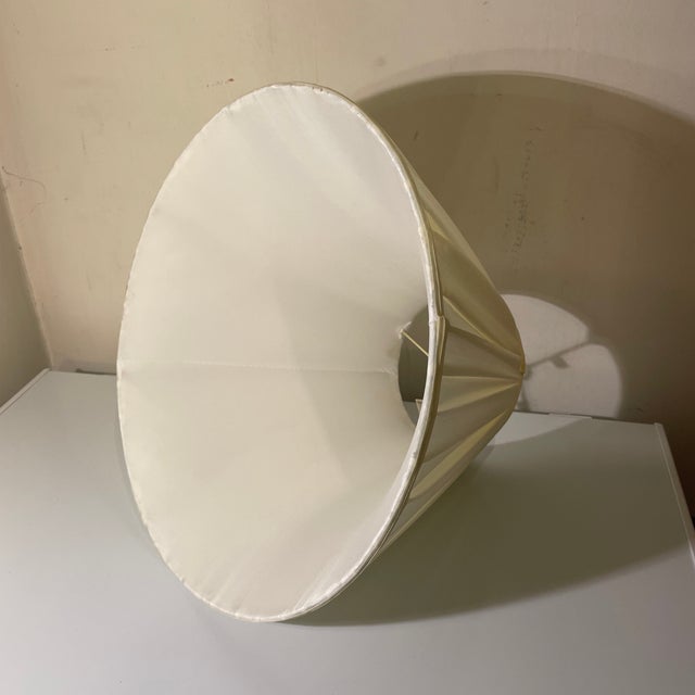 Eggshell ivory off white color, English box pleat style softback shade Self single fold trim top & bottom Lined in white...