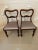 Pair of antique victorian mahogany side chairs having a pretty shaped top with a carved shaped splat to the centre of the...