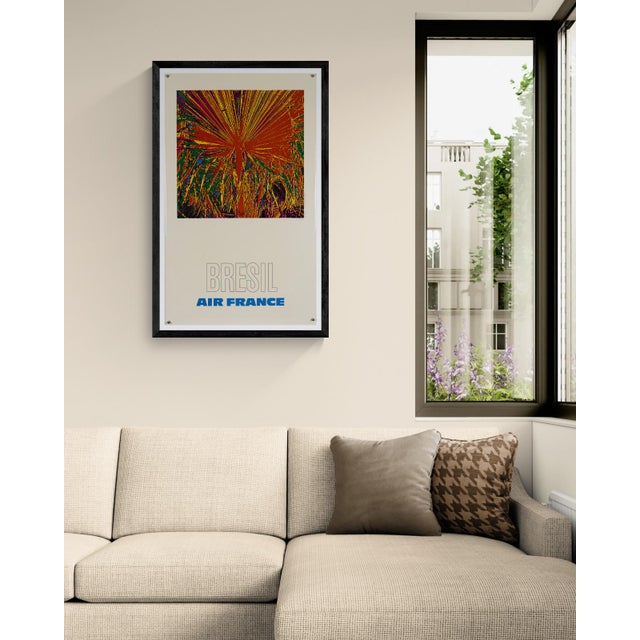 This original 1971 travel poster for Air France promotes flights to Brazil, designed by Raymond Pagès. The composition...