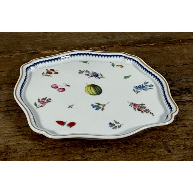 This Italian faience dish by Richard Ginori features a scalloped square form with molded edge detailing. The piece is...