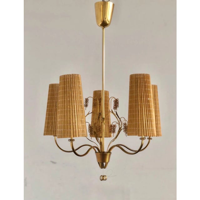 A Chandelier designed by Paavo Tynell for Taito Oy, Model 9015. Finland , circa 1940th. Marked ” OY TAITO AB 9015 ”....