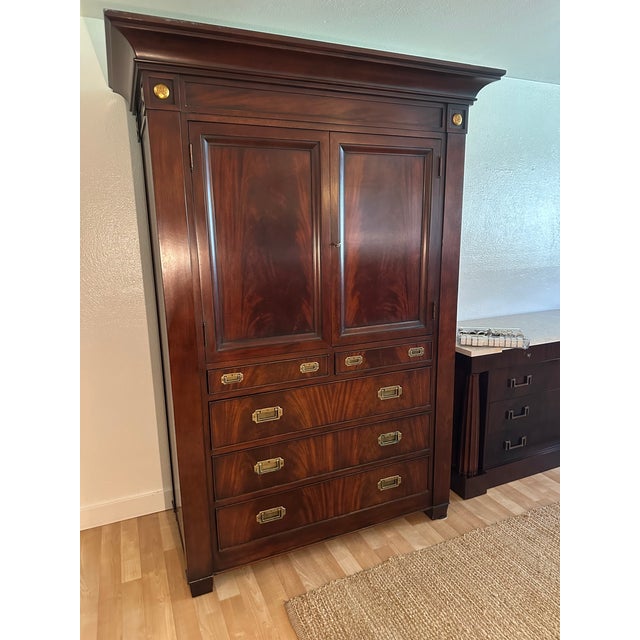 An exceptionally handsome Polo Ralph Lauren armoire showcasing the timeless sophistication, architectural presence, and...