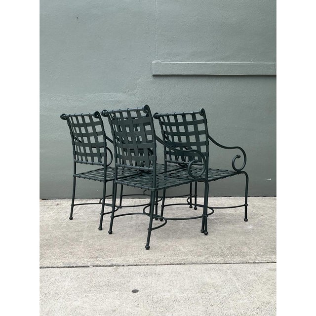 This exceptional set of four 1960s outdoor armchairs from Brown Jordan's highly coveted "Florentine" collection perfectly...