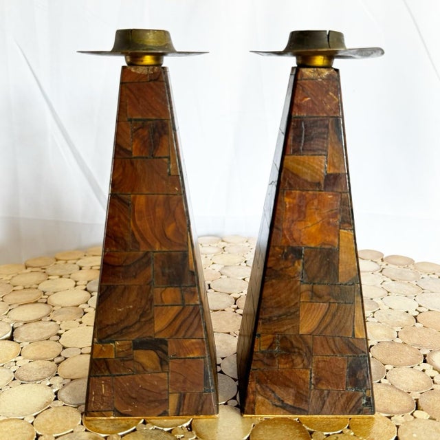 Celebrate tradition with this exquisite pair of Israeli olive wood Shabbat candlestick holders. Featuring a geometric,...