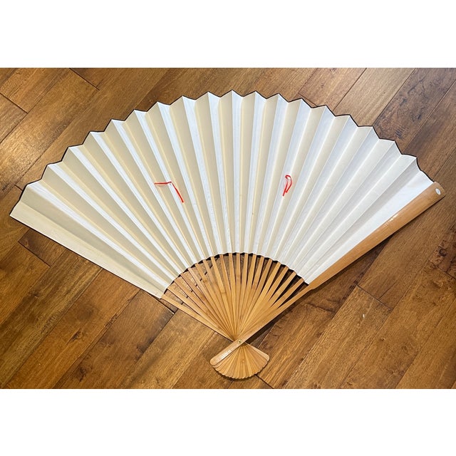 Large Chinese figural wall fan from the 1970s. Constructed of heavy paper and wood, with silkscreen art work. There are...
