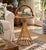 A particularly charming mid-century bamboo and rattan occasional table, distinguished by its oversized bent-bamboo...