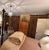 Set of six professionally fabricated custom drapery panels, comprising three matching pairs originally created for three...