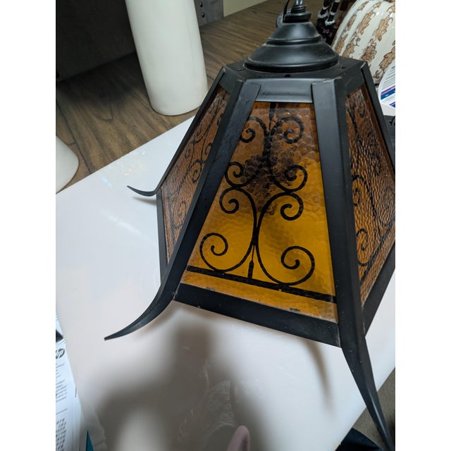 Spanish Revival Wrought Iron Swag Pendant Lamp Vintage Wrought iron Deign with curved outer pieces With Amber Panels With...