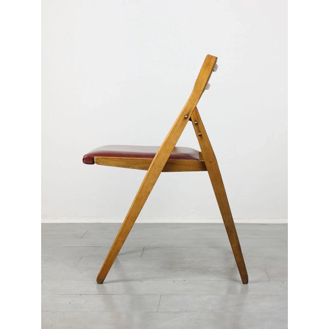 Vintage Red Eden Folding Chair by Gio Ponti, in Good conditions. Designed 1950 to 1959 This piece is attributed to the...
