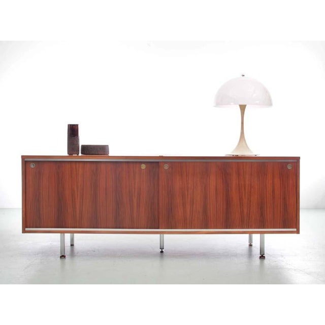 Teak sideboard by george nelson for herman miller, 2 sliding doors, tubular chromed metal legs. Some scratches and repair...