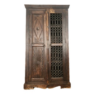 Antique Hand-Carved Wood Wardrobe with Carved Doors and Iron Grille, Bali, Indonesia, 1920s For Sale