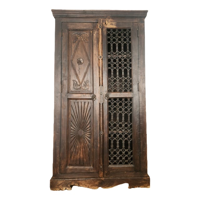 Antique Hand-Carved Wood Wardrobe with Carved Doors and Iron Grille, Bali, Indonesia, 1920s For Sale