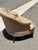 Vintage Tufted English Club Chair on Casters Classic English club chair featuring deep button tufting, gracefully rolled...