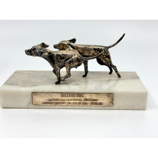 A nice sterling silver sculpture of 2 foxhounds running in sterling silver by the Venerable silversmiths S. Kirk and Sons....