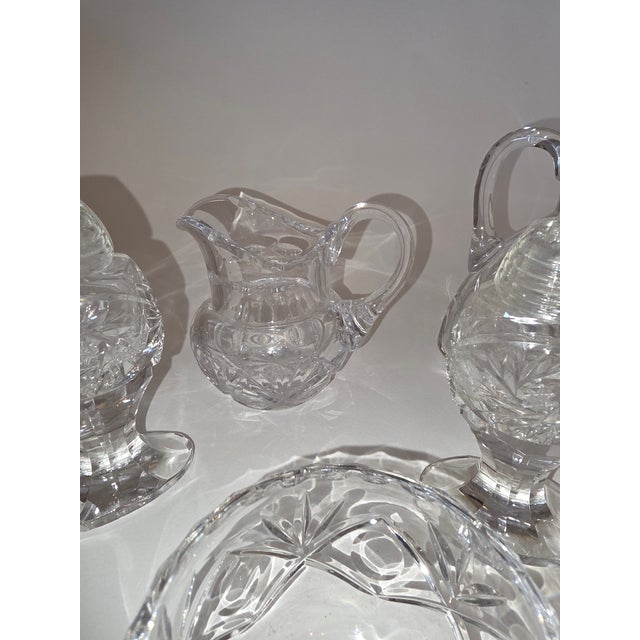 Nice collection of two Decanter and stopper bottles(7"h 4"w 2"d). A standing salt and pepper (4"h2.25"w 1.5"d)oval base...