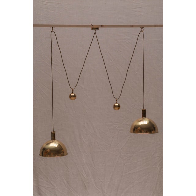 A striking and rare mid-century double pendant lamp by celebrated german designer florian schulz, model posa, crafted in...