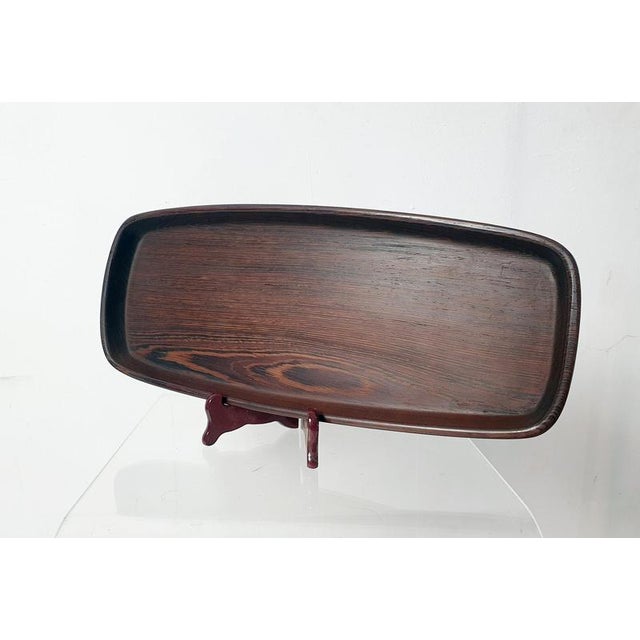 A lovely wooden tray by renowned by danish designer Hans Gustav Ehrenreich. The tray has a somewhat irregular shaped...