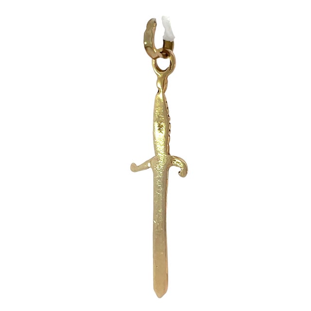 Sleek and detailed, this 14K yellow gold dagger pendant charm features a finely sculpted blade with a flexible bail for...