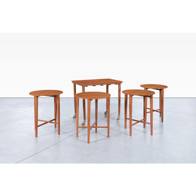 Vintage Danish modern teak nesting table designed by Carlo Jensen for Poul Hundevad in Denmark, circa 1960s. Ingeniously...
