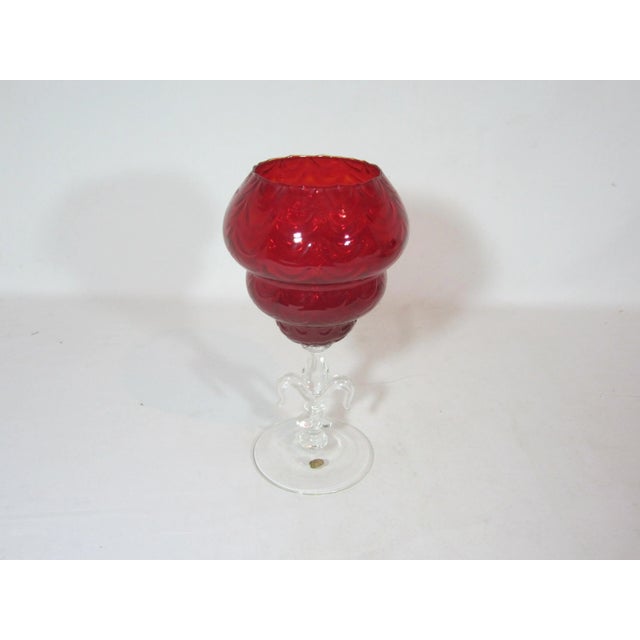 A wonderful Italian Ruby Red compote. It is designed with a three tier red bowl with a draped fold pattern. The bowl sits...