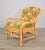 New cushions with emerald green and salmon orange indoor / outdoor fabric on this vintage rattan armchair. Made in San...