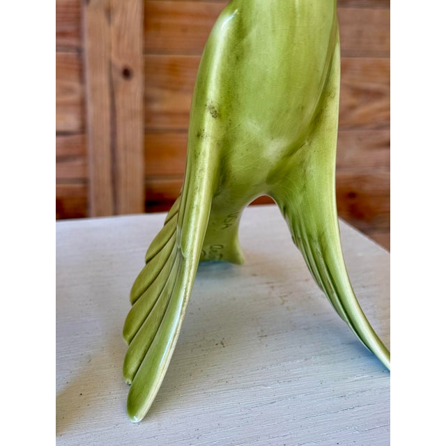 A striking and increasingly hard-to-find matching pair of mid-century ceramic peacock figurines by celebrated California...