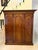 Antique Victorian quality figured mahogany three door wardrobe having a quality figured mahogany shaped cornice above...