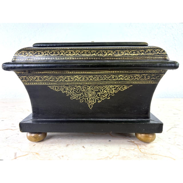 This is a mid 20th century Italian tooled leather dresser box. This beautiful box stands on four solid brass bun feet and...