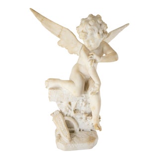 Early 20th Century Alabaster Carved Figure of Cupid With a Butterfly For Sale