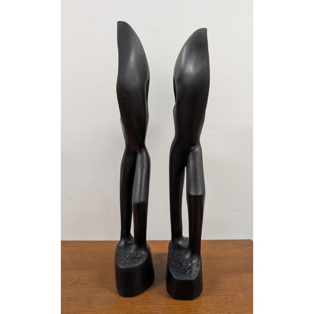 Discover a true masterpiece of West African artistry with this rare hand-carved African Angel of Peace sculpture from...