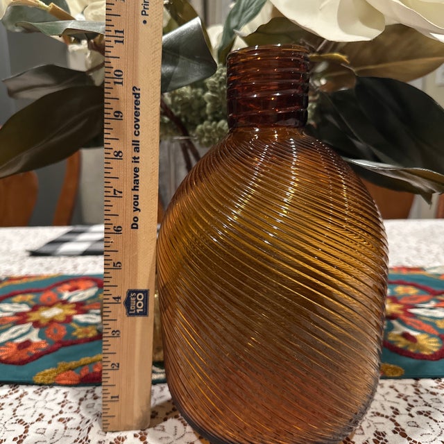 A beautiful 1940s Amber Owen’s Duraglas bottle with swirls design. Found in my mom‘s home that was used for flowers during...