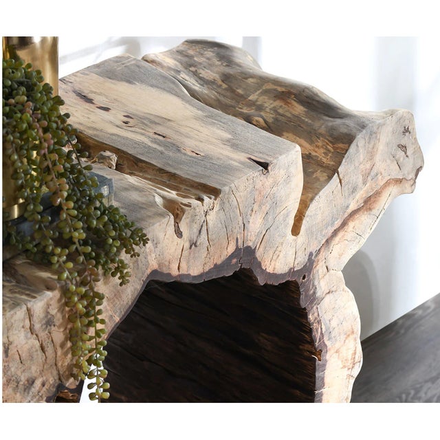 Classic Home Furnishings Hand-carved console from solid tamarind wood, this organic console table is a sculptural...