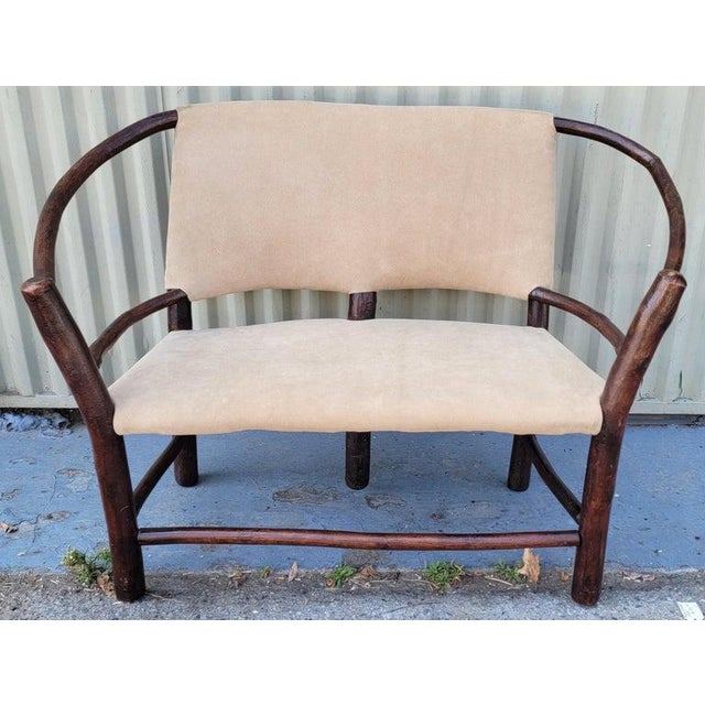 Old Hickory Child's settee in sued /leather seat & backing.The condition is very good and sturdy. Newly upholstered in suede.