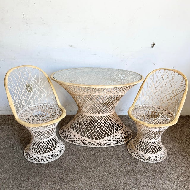 Bring vintage flair to your outdoor or indoor space with this Mid Century Modern dining set by Woodard. This unique...