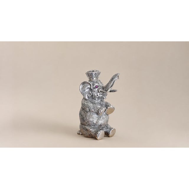 This is an extremely unusual Imperial Russian silver perfume bottle, crafted in the form of an elephant figurine, a truly...