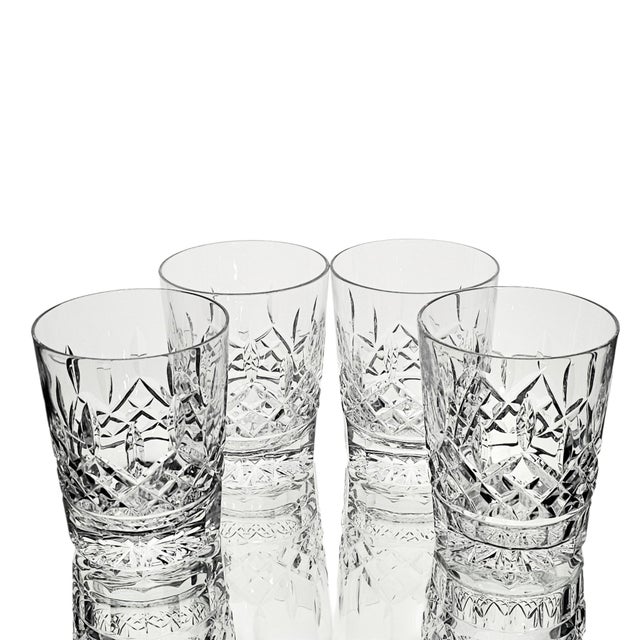 Set of four Waterford Crystal Lismore Double Old Fashioned glasses in the iconic Lismore pattern. Produced in Ireland,...
