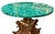 A remarkable late-19th-century Italian center table combining an elaborately hand-carved sculptural wood pedestal with a...