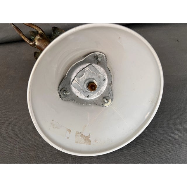 female nude figure, car ornament. sculpture made of bronze and mounted on a conical metal base for display. . We do not...