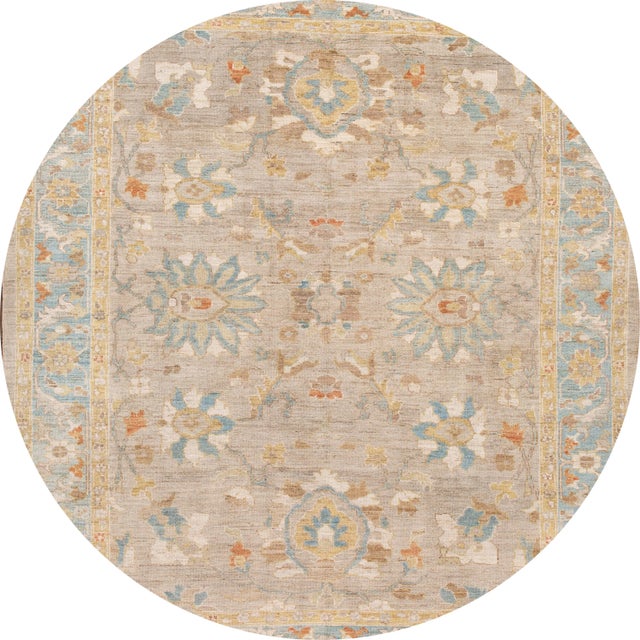 Beautiful contemporary Sultanabad rug, hand knotted wool with a tan field, blue and ivory accents in an all-over design....