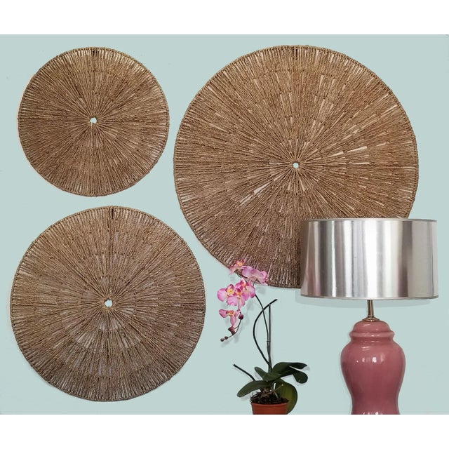 Offering a large Trio of Organic Mid-Century Modern Jute Circular Wall Sculptures with steel framing support. These large...
