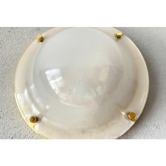 Beautiful mid-century design. 1970s ceiling or wall lamp made by the renowned German company Glashütte Limburg. Round...