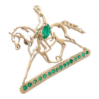 14k Yellow Gold Emerald and Diamond Studded Horse Rider Brooch For Sale